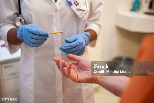Close Up Shot Of Healthcare Workers Gloved Hands Holding Blister Pack Of Medication Stock Photo - Download Image Now