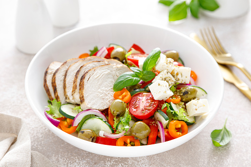 Grilled chicken breast and fresh greek salad with feta cheese