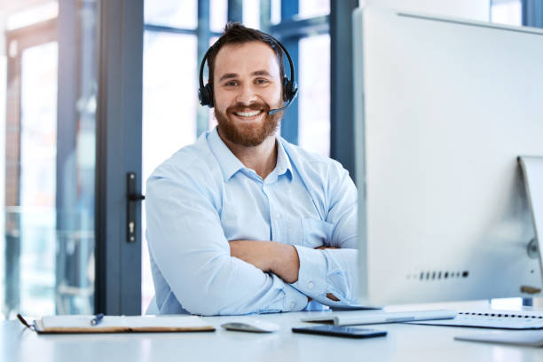 istock Portrait of a young call centre agent working on a computer in an office 1397842818