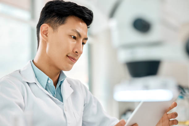 istock Shot of a young scientist using a digital tablet in a lab 1397843854