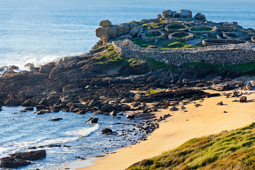 Hill fort 'Castro'  Baroña and beach, A Coruña  province, Rías Baixas, Galicia, Spain. Headland in front of the Atlantic ocean set 1st century BC. The Hill fort 'Castro' of Baroña is completely public free access.