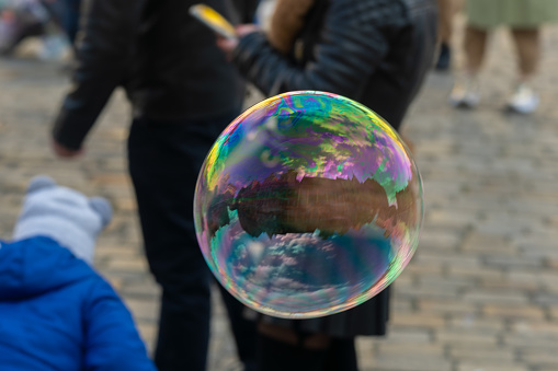 People are making soap bubble and playing in old town Wroclaw