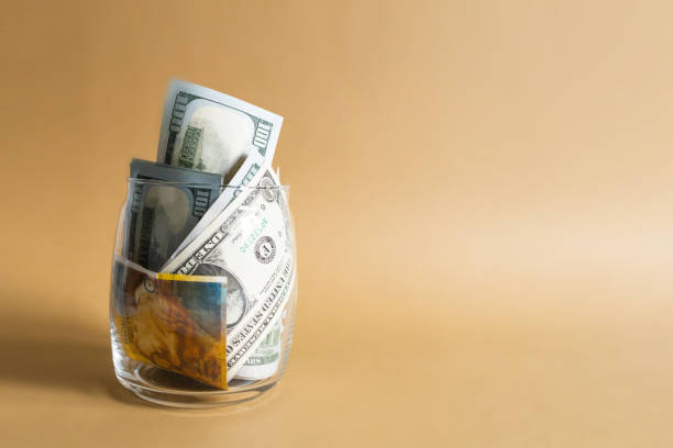 istock Bills in a glass jar 1397847237