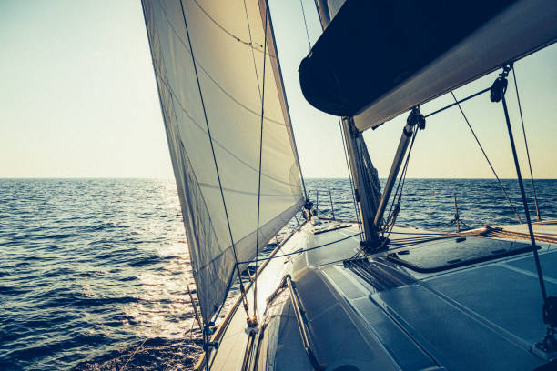 istock Sailing with sailboat at sunset 1397847911