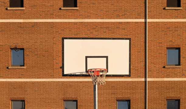istock Basketball hoop against building with windows 1397847916
