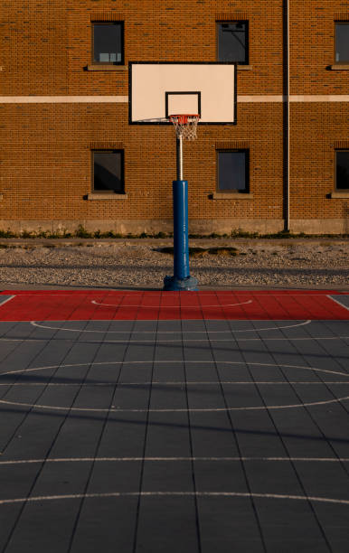 istock Basketball hoop against building with windows 1397847918