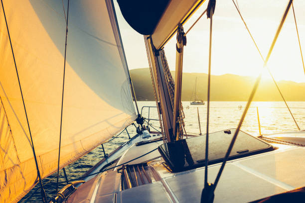 istock Sailing with sailboat at sunset 1397847962