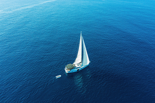 Sailboat during sailing. High angle view from drone.