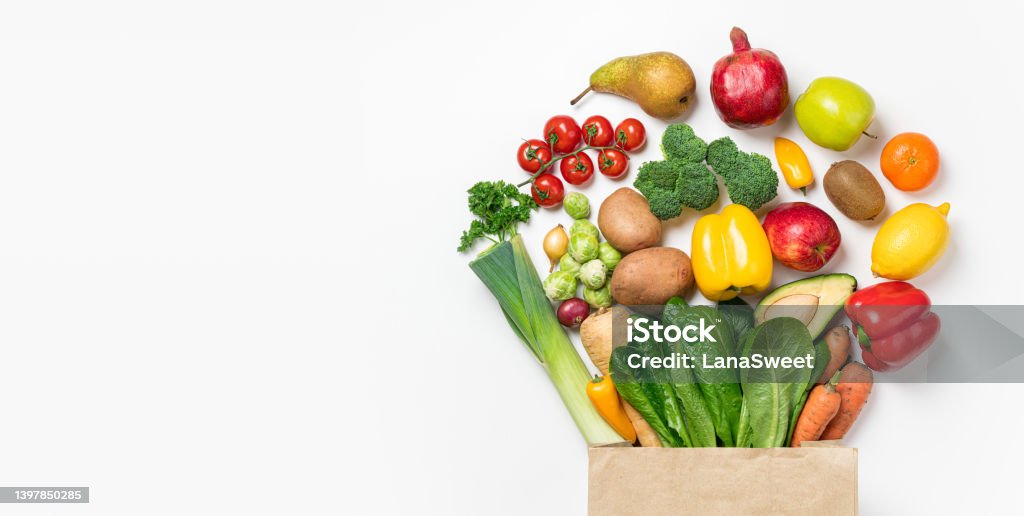 Healthy food background. Healthy food in paper bag vegetables and fruits on white. Food delivery, shopping food supermarket concept Vegetable Stock Photo