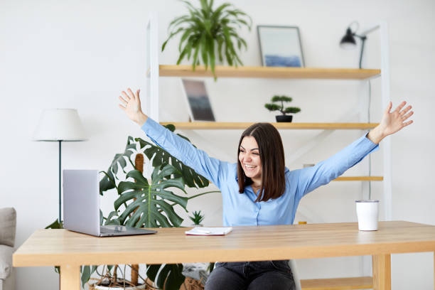 istock Happy young business woman entrepreneur using computer looking at screen working in internet sit at office desk 1397850334