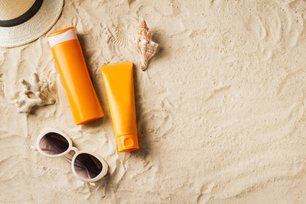 istock Sunscreen sunblock lotion on sandy beach 1397850387