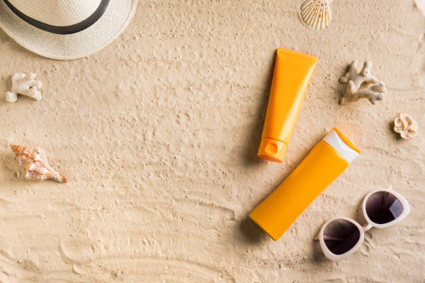 istock Sunscreen sunblock lotion on sandy beach 1397850526