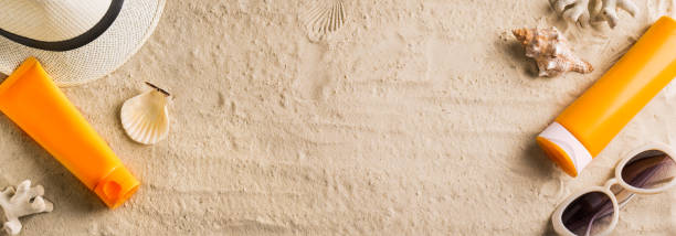 istock Sunscreen sunblock lotion on sandy beach 1397850552