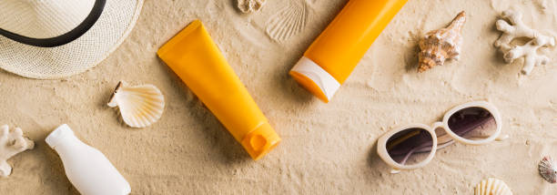 istock Sunscreen sunblock lotion on sandy beach 1397851075