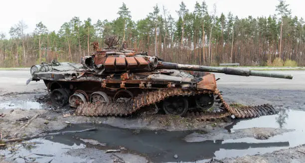 Photo of Destroyed russian tank on roadside in invasion of Ukraine