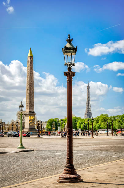 Paris, France - April 18, 2013: The place de la Concorde was designed in 1755 and now is the largest public square in Paris. In the center of place is placed giant Egyptian obelisk decorated with hieroglyphics exalting the reign of the pharaoh Ramesses II. Unidentified people present on picture.
