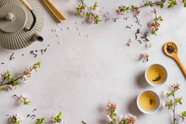 té verde y flor de cerezo - green tea cherry blossom china cup fotografías e imágenes de stock