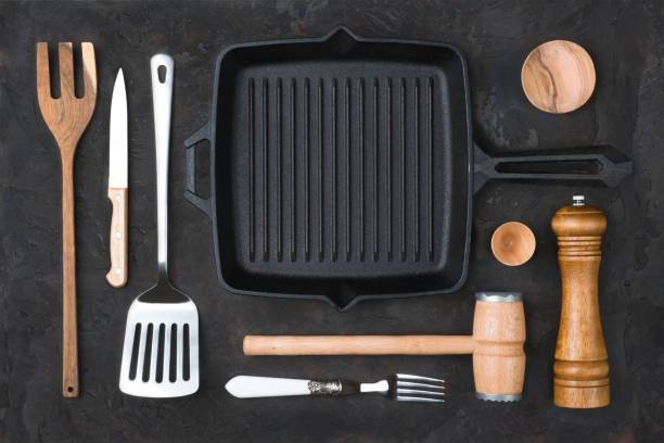 istock Collection of kitchen utensils top view on dark stone table 1397852290