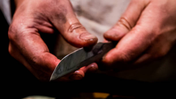 istock Swordsmith is checking sharpness of blade of small katana 1397853244