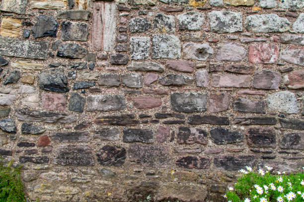 istock Old medieval European stone wall texture background 1397853261
