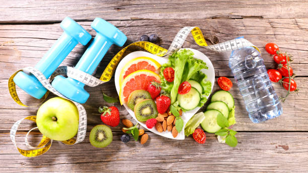 istock diet foodconcept with dumbbell,  meter,  fruit and vegetable 1397854846