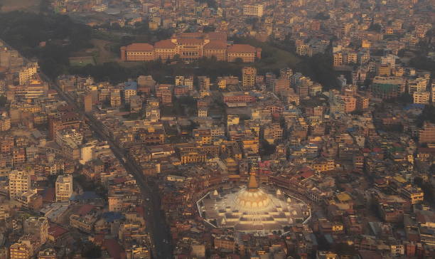 Aerial view of Kathmandu. Boudhanath  (or Bodnath) Stupa, a huge, dome topped Buddhist temple stands out of the buildings, Nepal stock photo