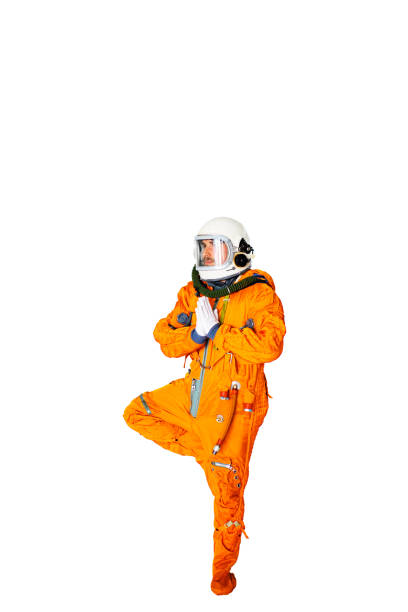 istock Young Man In Space Suit Practising Yoga 1397855922