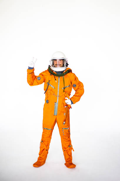 istock Young Man In Space Suit Showing Two Fingers 1397855953
