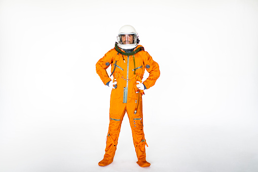 Young Man In Space Suit Standing With Arms Akimbo