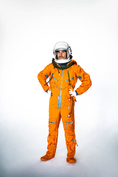 istock Young Man In Space Suit Standing With Arms Akimbo 1397855983