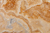 Onyx Miele background, natural texture in warm tone. Slab photo.