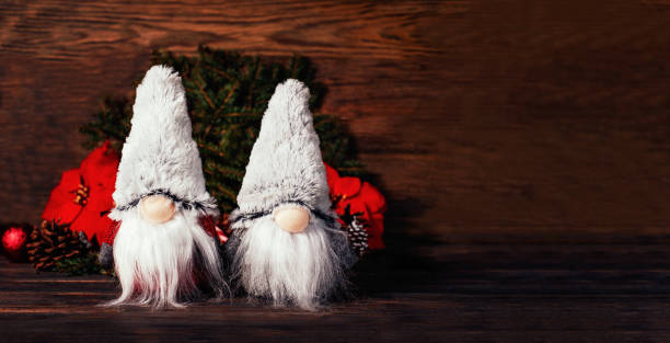istock Christmas composition with gnome and festive decorations on wooden background. 1397857099