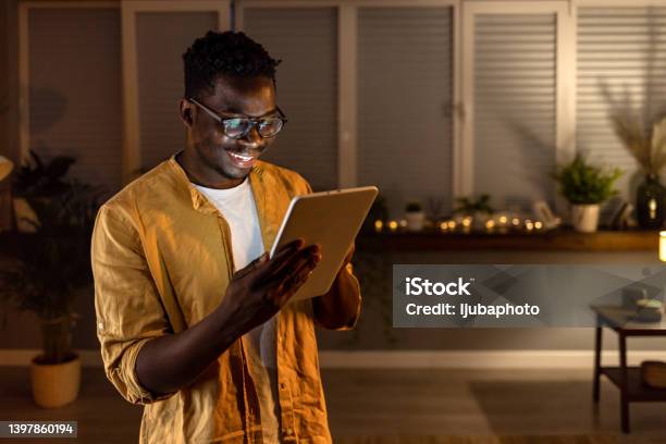 Making Days At Home So Much More Entertaining Stock Photo - Download Image Now - Digital Tablet, Men, Smiling
