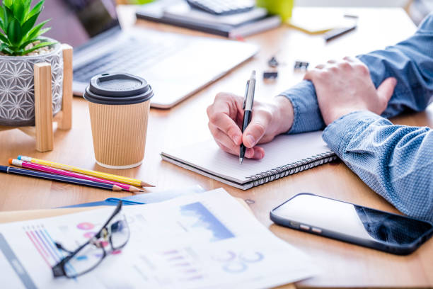 istock Unrecognizable businessman working at the office desk 1397860785