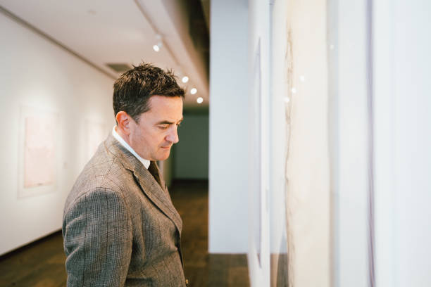 istock Man at Opening in Gallery 1397860967