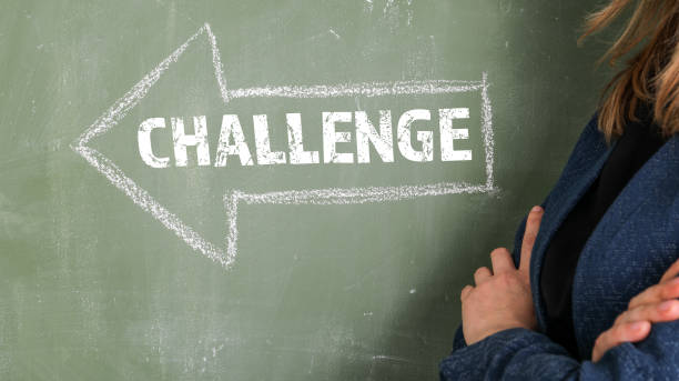 istock CHALLENGE. Arrow with text on a green chalk board 1397862839