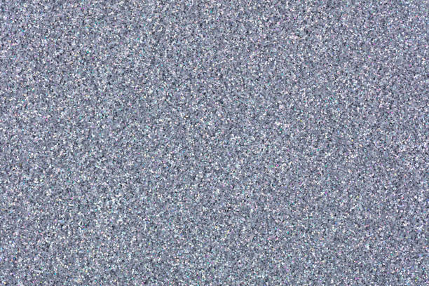 Glitter texture for your stylish Christmas desktop, shiny background in light grey tone. High resolution photo.