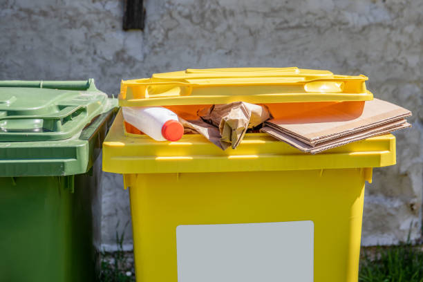 Overfilled sorted waste container. Waste collection and recycling