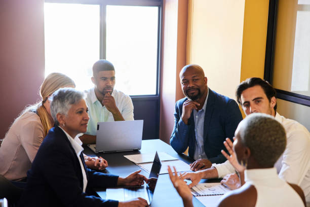 istock Diverse businesspeople having a meeting around a table in an office 1397868192