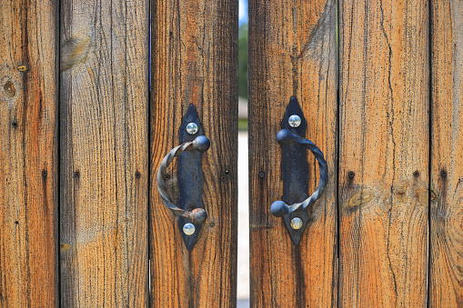 Old vintage medieval wooden door close-up