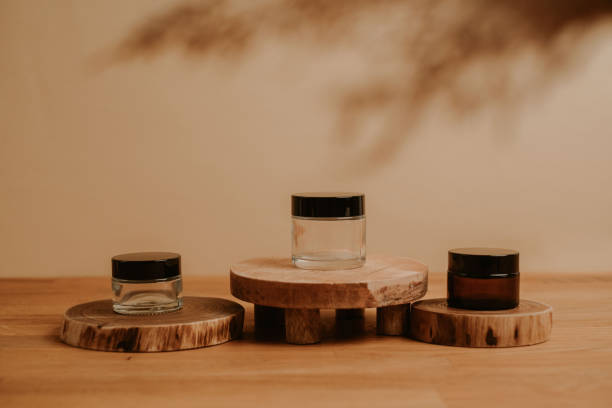 istock Set of glass containers on wooden platform 1397869577