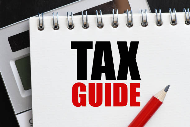 istock TAX GUIDE words in an office notebook. Concept for business 1397869613