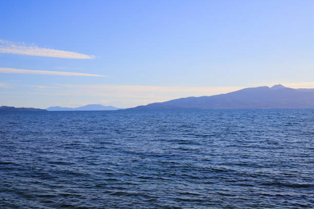 istock Sea view with moountains and blue sky 1397869673