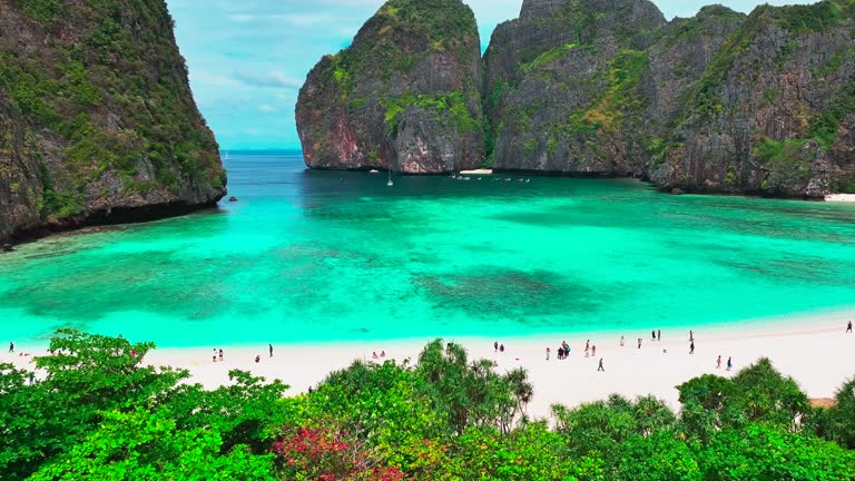 Aerial view of Maya bay. Maya Bay is the crown jewel of Phi Phi Islands in southern Thailand. It is situated in the Hat Noppharat Thara – Mu Ko Phi Phi National Park in Thailand.