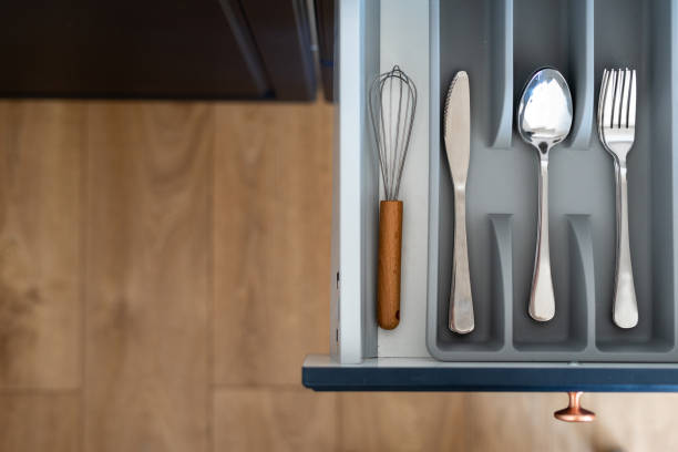 istock Cooking whisk, silver spoons, forks and table knives in kitchen drawer 1397870643