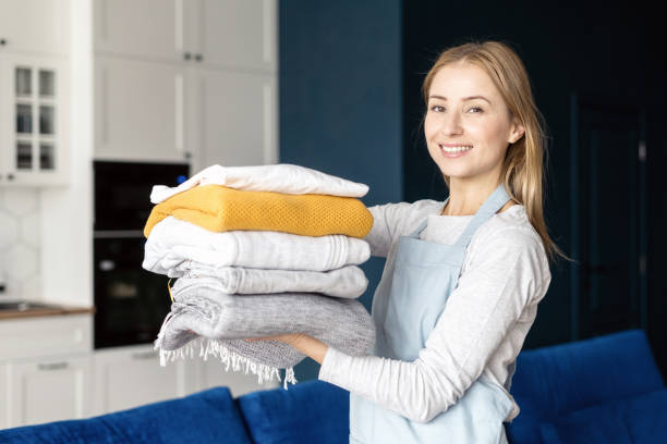 istock Female folded clean and dry laundry clothes in stack 1397870981