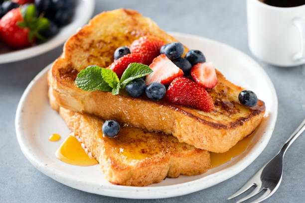 French toast with honey and berries stock photo