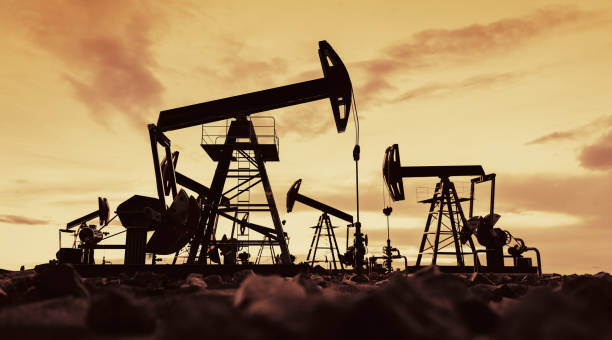 istock Oil pump jack work on oilfield petroleum extraction 1397873251