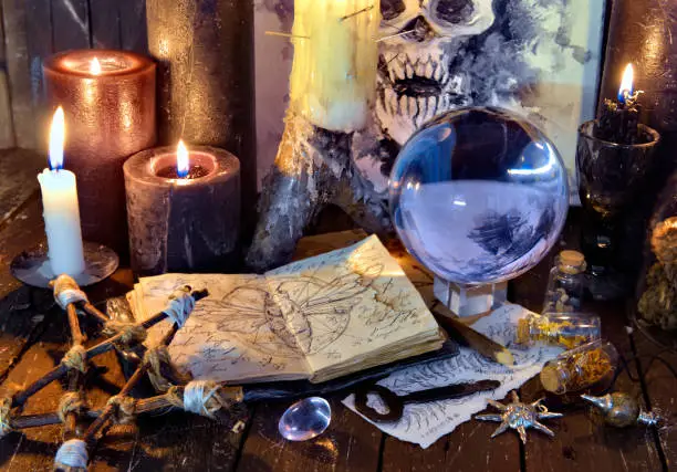 Wicca, esoteric and occult still life with vintage magic objects on witch table altar for mystic rituals and fortune telling. Halloween and gothic concept