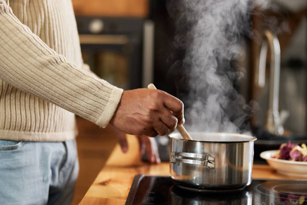 istock Close up of a black bachelor cooking lunch. 1397875421